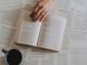 flat lay photography of an open book beside coffee mug