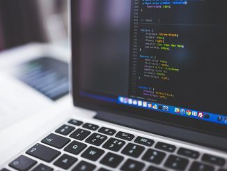 gray laptop computer showing html codes in shallow focus photography