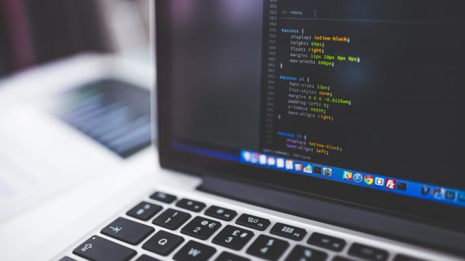 gray laptop computer showing html codes in shallow focus photography